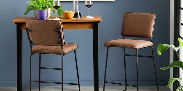 brown leather bar stools with metal legs.